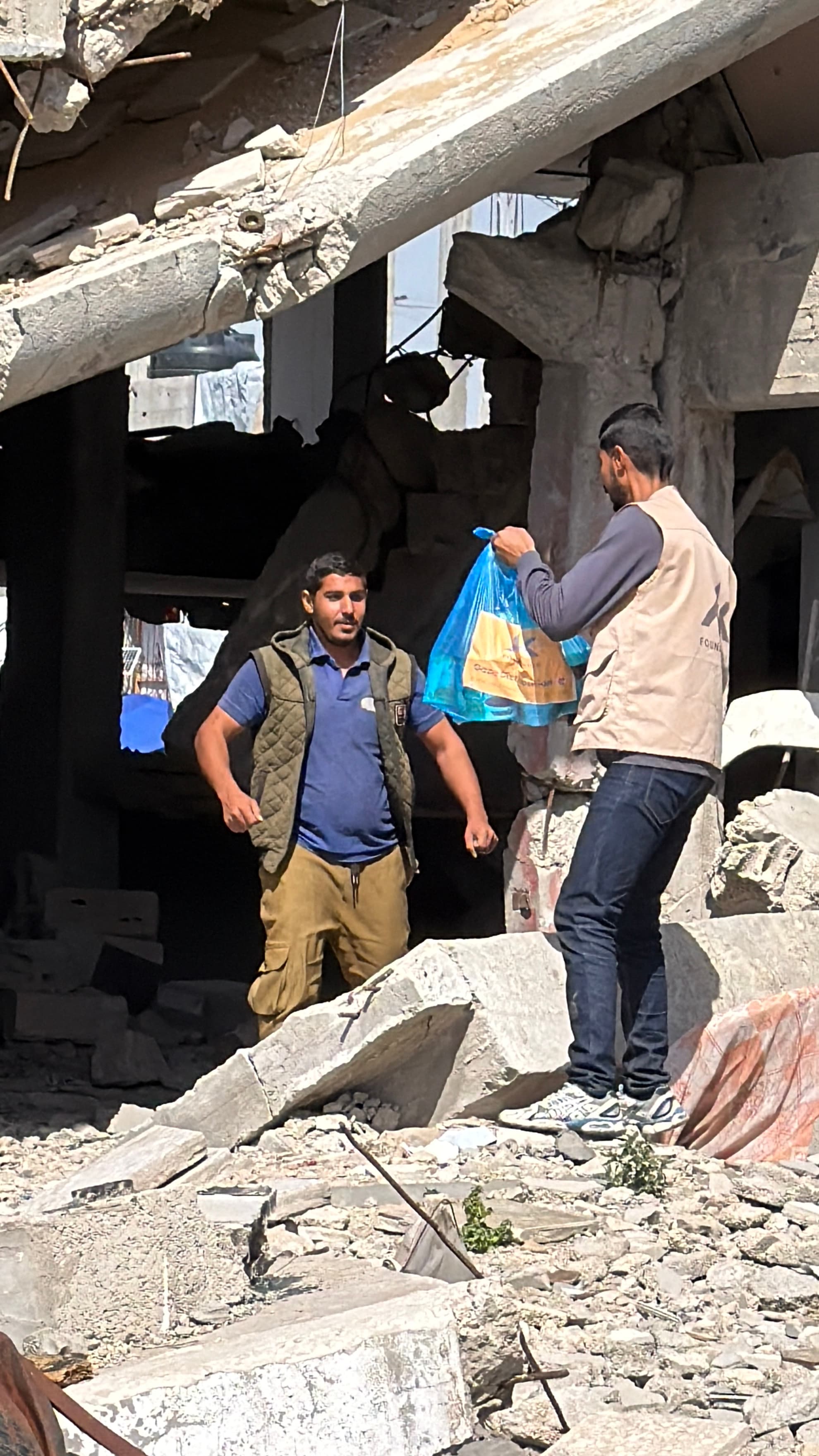 Families gathering for food distribution in Gaza