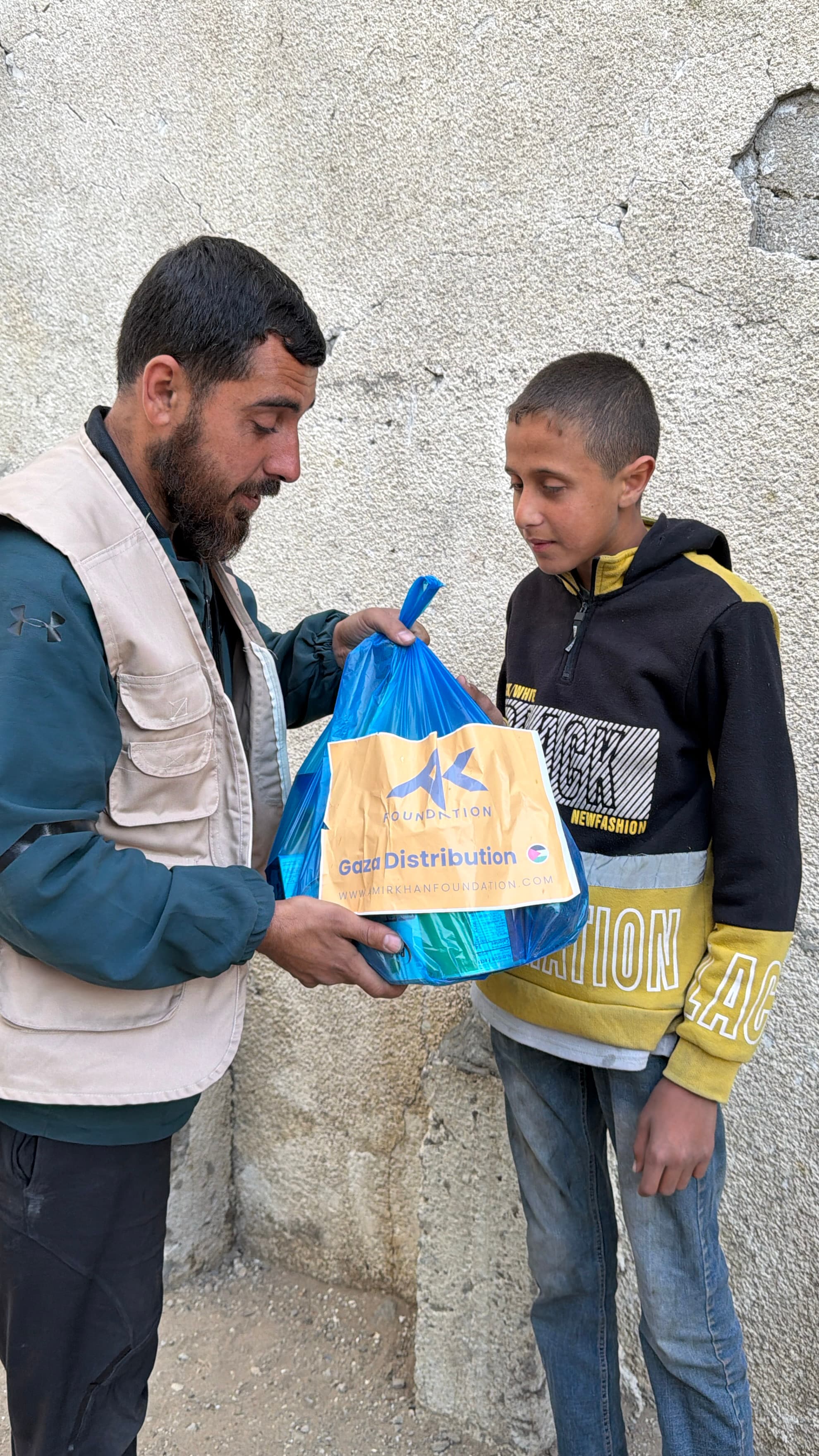 Family receiving food pack in Gaza