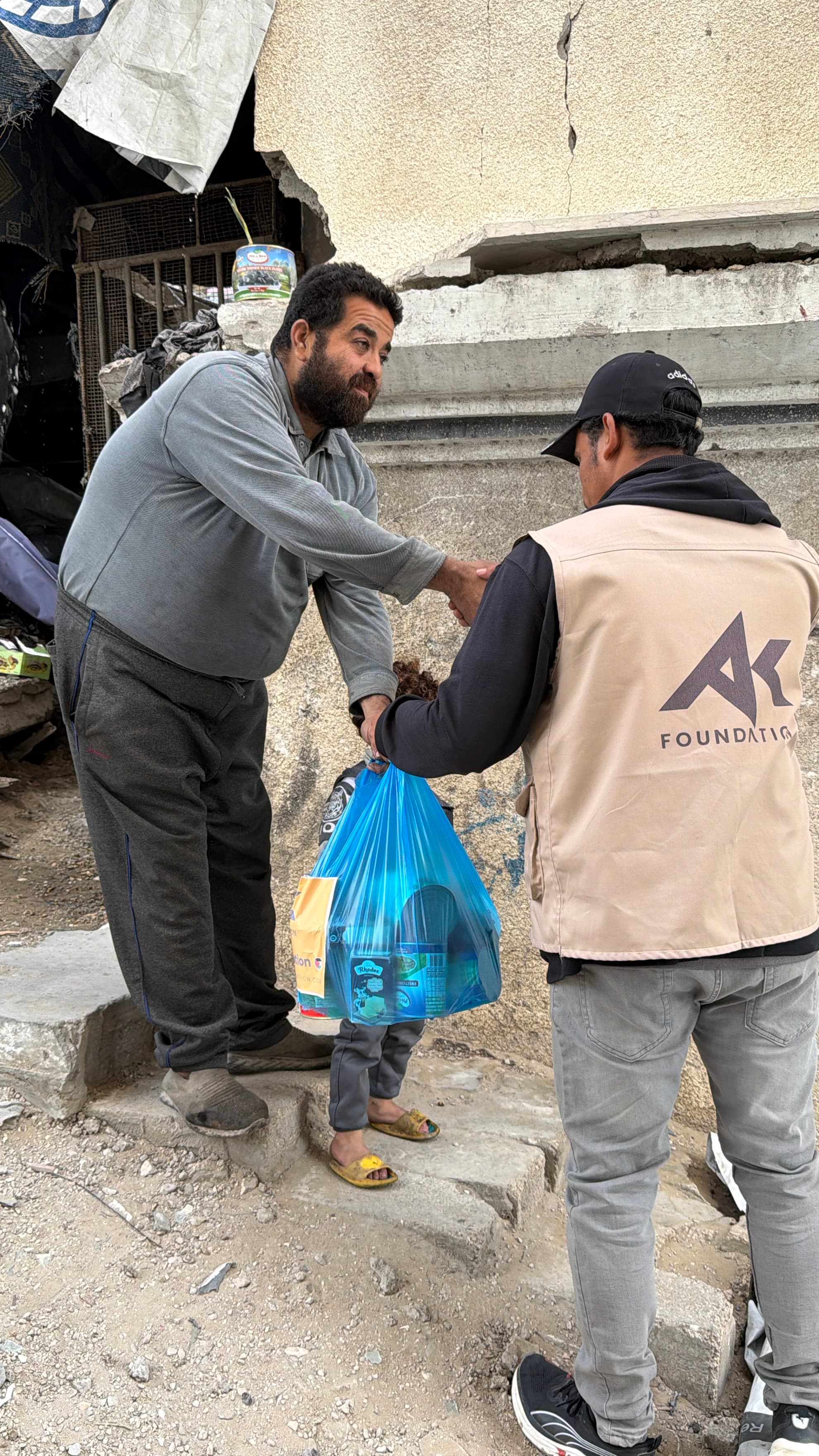 Food pack handover to family in Gaza